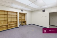 Office space with built-in shelves and workstation area