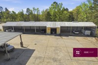 Covered equipment bays with vehicles and storage areas